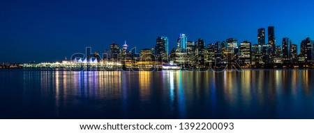 Night Vancouver. Reflection of city's skyline.