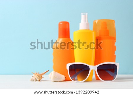 Set of different sun creams on a colored background. Cosmetics for sun protection.