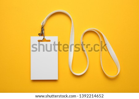 Job identity name tag on yellow background, badge and lanyard. Staff identity card.