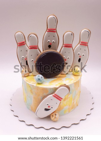 cake decorated with cookies on the theme of bowling