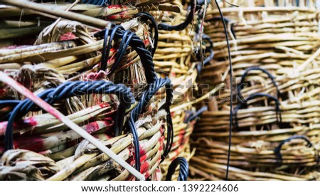 Stack of big wicker baskets in market