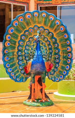 Colorful peacock statue at Kanchanaburi, Thailand.