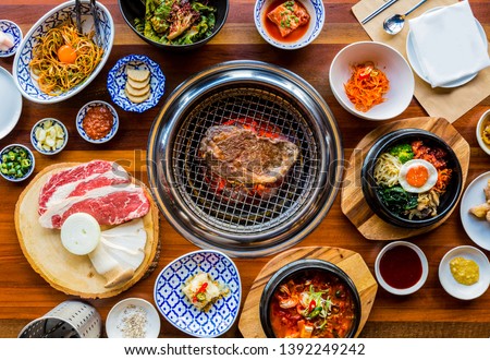 Full set of beef and pork ready for grill on stove serve with vegetable,soup and rice and side dish, Korean style barbecue Royalty-Free Stock Photo #1392249242