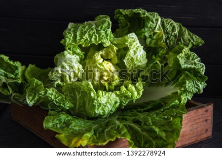Peking cabbage in a wooden box on a rustic background. Diet proper nutrition. Vegetables and fruits. Dark Food Photography - Image
