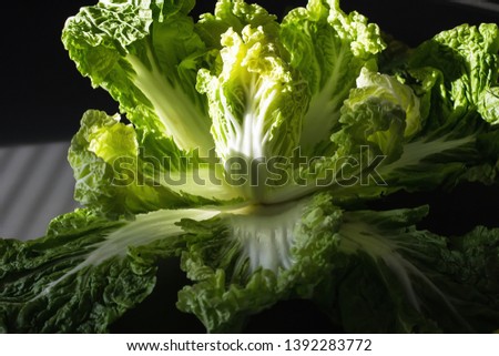 Peking cabbage in a wooden box on a rustic background. Diet proper nutrition. Vegetables and fruits. Dark Food Photography - Image