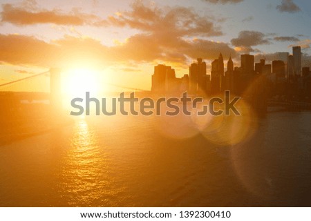 Beautiful sunset over a Manhattan with Brooklyn Bridge.