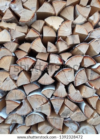 Background of wooden logs. Year rings. Pile wood. Deforestation theme. Wood industry. Chopped wood. Woodpile scene.