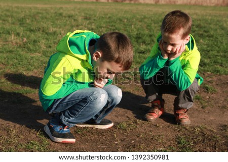 Boy, child, two, brothers, sit, leaning on the ground, close-up