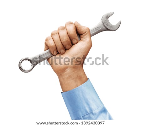 Man's hand in a shirt holds a wrench isolated on white background. Close up. High resolution product