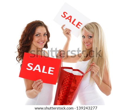 Young beautiful  women with shopping bag and sale sign  on a white background.