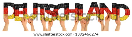 people arms hands holding up wooden letter lettring forming word Deutschland (english translation: Germany) in german national flag colors tourism travel nation concept isolated on white background