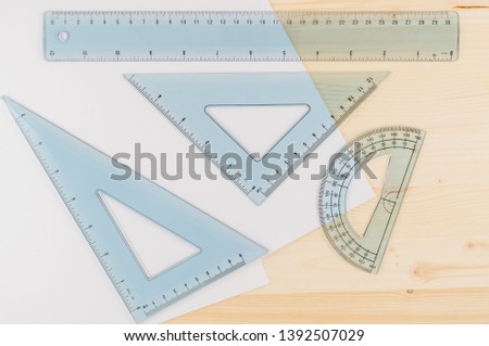 Ruler Combo Set. Ruler, Protractor, Triangle, Top View, Close Up, Wooden Background