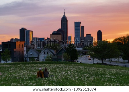 Shared moments watching the sunset behind the city skyline