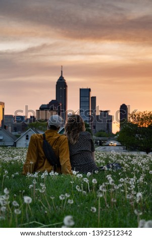 Shared moments watching the sunset behind the city skyline