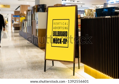 Mock up vertical blank billboard with clipping path, Advertising signage for promotion on the floor at corridors inside the department store, yellow screen empty space for insert text or media