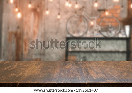 Empty Selected focus wooden table with bokeh  blurred background  restaurant free space for decoration display or montage product can be used.