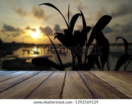 Texture wooden floor with sunset view on the beach. Beautiful sunset for the background. Studio table room background. Wood floor with sunset beach.