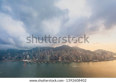 Victoria harbour cityscape during sunset, view from high building at Tsim Sha Tsui, Hong Kong