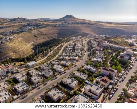 The settlement Tekoah in the Judean desert, Israel. View from the drone. Royalty-Free Stock Photo #1392623450