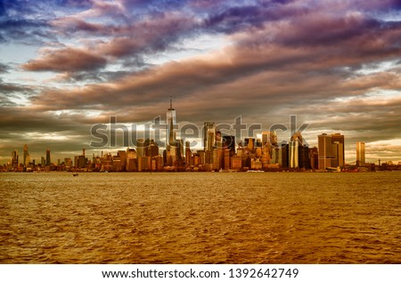 Amazing sunset skyline of Lowr Manhattan from a ferry boat, USA