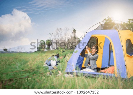 A group of girls that they are camping in the forest.