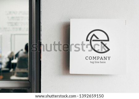Square white sign mockup on a wall