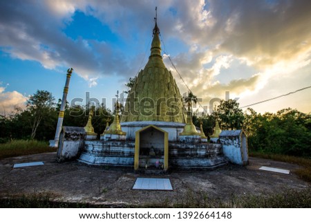 The background of the golden yellow pagoda that is built on the mountain allows tourists to take a picture or make merit while traveling.