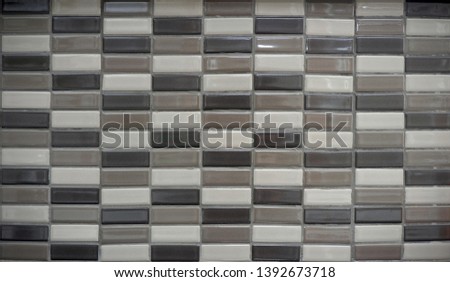 beautiful ceramic tiles brown color arrangement row and column background, background of wall or floor with dynamic brown and beige color, texture of tiles for room and house decoration, tiles pattern