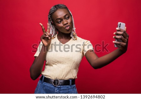 Young African American woman taking a selfie