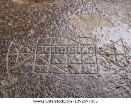 Ancient board game carved on to the stone floor of Ellora caves
