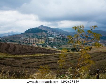 View of Gangi from afar on a rainy day, Sicily, Italy
