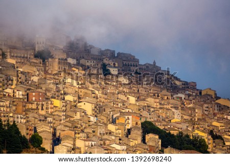 The fog rises over Gangi after a summer storm