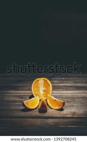 Ripe orange on a wooden surface