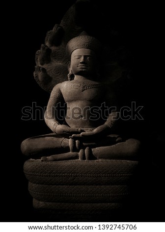 King Buddha statue monument sitting meditation  carved from sandstone,Art style older than a thousand years-image
