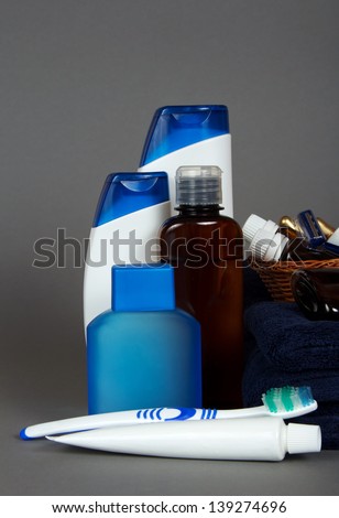 Set of man's cosmetics for care of a body and an oral cavity, on a gray background
