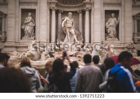 The Trevi fountain in Rome full of photographers tourists