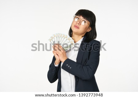   business woman in a suit with money                             