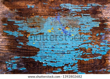 Rusty old wooden wall painted blue. Detailed photo texture. Blue paint peeling, cracked.
