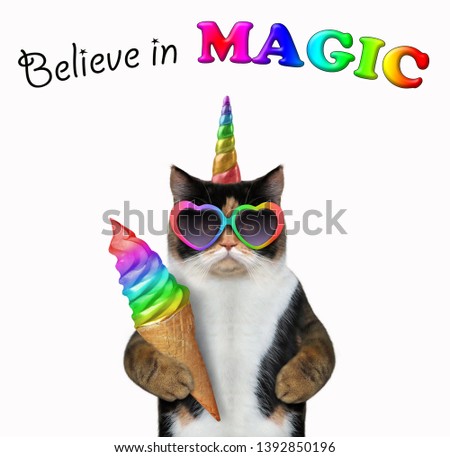 The cat unicorn is eating a big bitten color ice cream. Believe in magic. White background. Isolated.