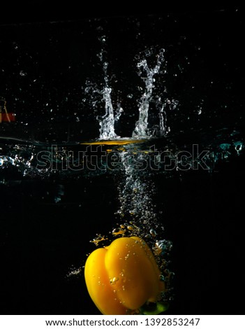Yellow fruits drop in the water