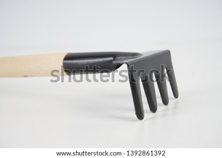 gardening tools with shovel, trowel and rake over white background