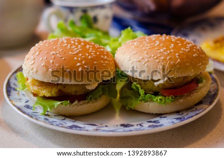Vegetarian hamburgers made with potato cutlet, tomatoes, salad and onion