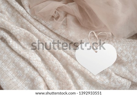 Clothes label tag on cloth background. Branding template mockup