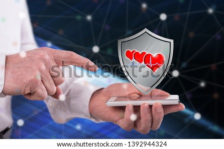Healthcare concept above a smartphone held by a man