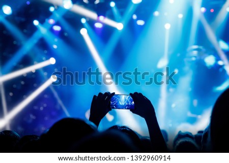 Social media photo to mobile phone. Concert light performance
