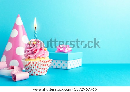 Colorful celebration background with various party decoration and cupcake. Minimal party concept.  Royalty-Free Stock Photo #1392967766