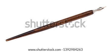 dip pen with sharp steel nib and wooden brown penholder isolated on white background Royalty-Free Stock Photo #1392984263