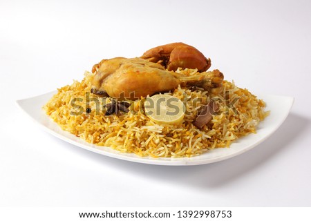 Isolated delicious spicy chicken biryani in white bowl on white background, Indian or Pakistani ramzan food. Beautiful view of traditional spicy indian food, Iftar meal, Ramadan dinner. Royalty-Free Stock Photo #1392998753