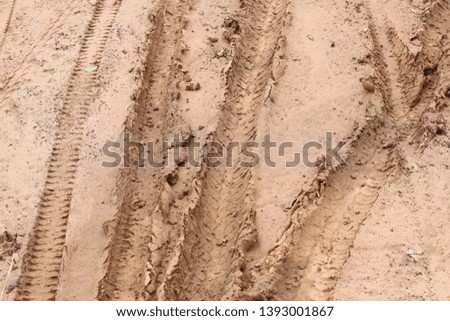 motorcycle tire tracks on the ground