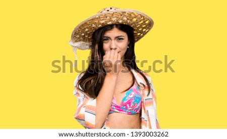 Teenager girl on summer vacation having doubts over isolated yellow background